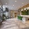 Resident lounge and lobby at The Leaf apartments in New Rochelle, NY, featuring elegant decor and glass doors.