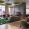 Resident lounge at The Leaf apartments in New Rochelle, NY, featuring cushioned seating and a pool table.