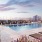 The rooftop pool at The Leaf apartments in New Rochelle, NY, featuring lounge chairs and a view of the city.