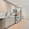 Sophisticated studio at The Leaf featuring quartz countertops, stainless steel appliances, and designer lighting.