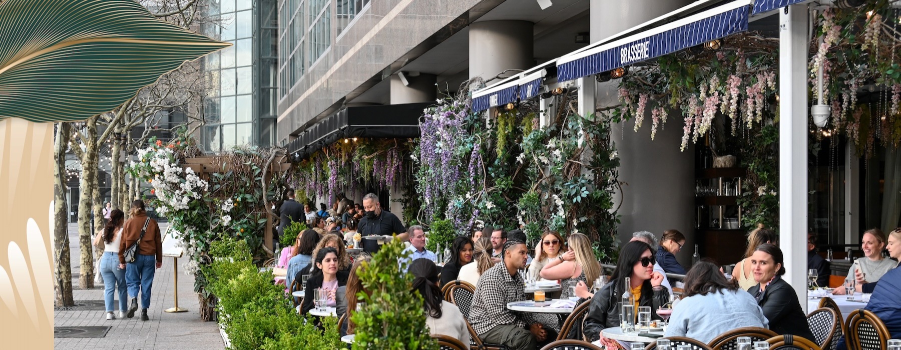 people sitting at tables outside